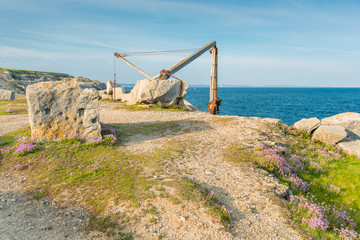 Portland Bill with the corroding remains of a disused quarry hoist on the Isle of Portland, Dorset. England. UK.