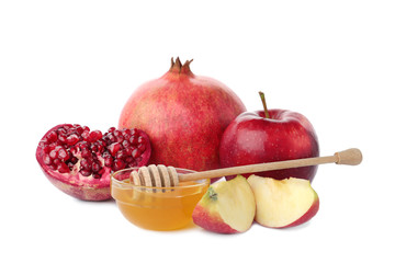 Honey, apples and pomegranate on white background. Rosh Hashanah holiday