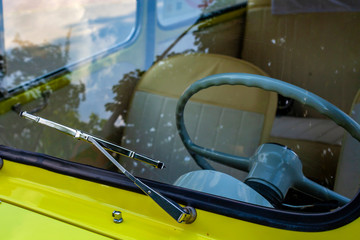 steering wheel behind the windshield