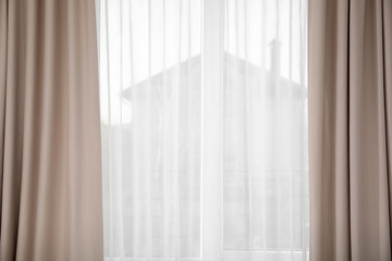 Window with elegant curtains indoors. Interior element