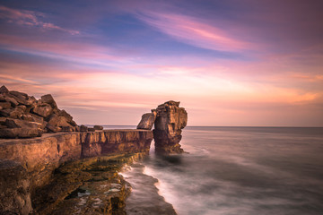 Sunset over Pulpit Rock at Portland Bill on the Isle of Portland near Weymouth on Dorset's Jurassic Coast. England. UK. © Andrew
