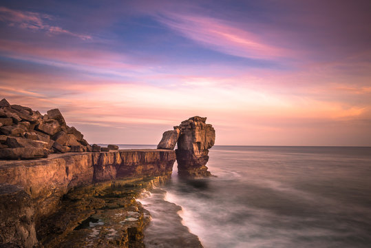 Sunset over Pulpit Rock at Portland Bill on the Isle of Portland near Weymouth on Dorset's Jurassic Coast. England. UK.