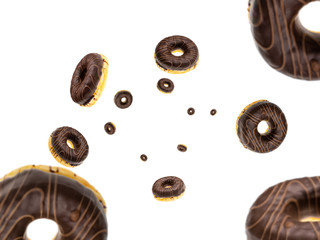 Delicious pastry breakfast. Flying cookie. Round sweet doughnuts in motion flying on white background