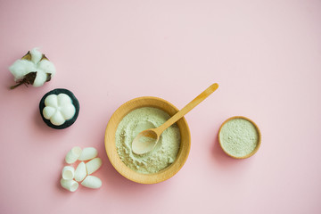 Cosmetic bath salt, grape gomaj for the face, coffee scrub for the body on a pink background.