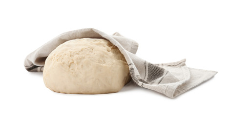 Dough for pastries covered with napkin on white background