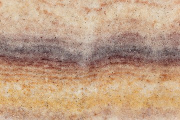 Macro photo of a rainbow sandstone from India.