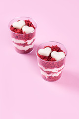 Delicious and beautiful dessert, red velvet in cups. Hearts of white chocolate. Valentine's Day.