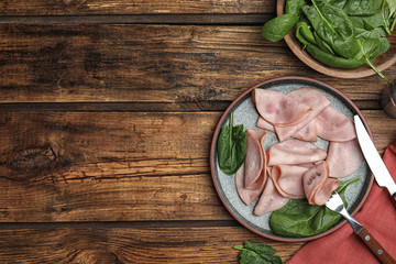 Tasty ham served on wooden table, flat lay. Space for text