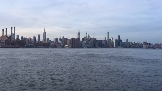 New city skyline across river skyscrapers of downtown Manhattan stock footage video 