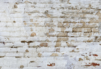 Brick With Taces of White Paint on Wall