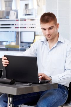Young businessman with laptop