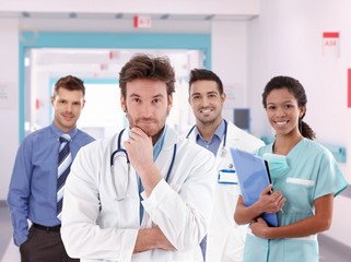 Group portrait of doctors at hospital hallway