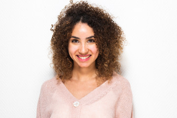 Close up horizontal portrait of happy young African american woman with curly hair