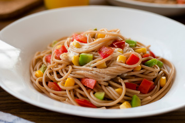 Delicious vegan pasta salad with tahini dressing. Noodles with quinoa or whole wheat pasta.