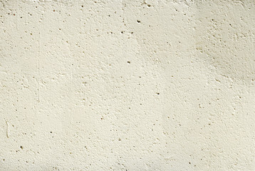 Light Orange Porose Stucco on Wall
