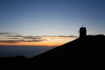 Dawn at the little church, mount Grappa landscape, Italy