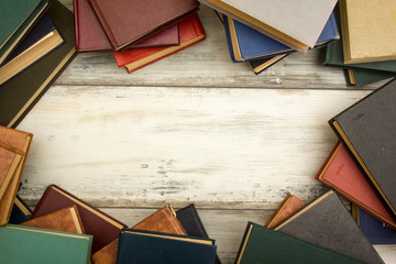 Open book, hardback books on wooden table. Back to school. Copy space