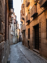 Beautiful streets of the city of Toledo, with balconies and sunny day