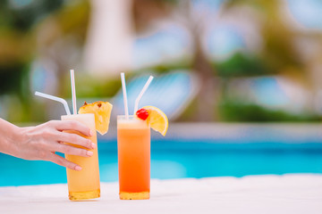 Two tasty cocktails on tropical white beach