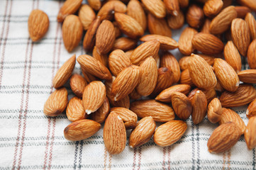 peeled almonds on checkered fabric