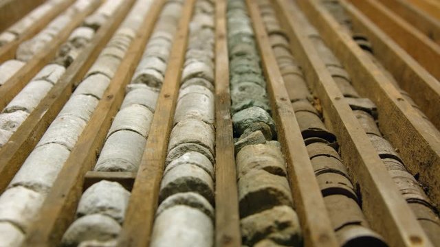 Drill core samples from geological borehole in wooden box