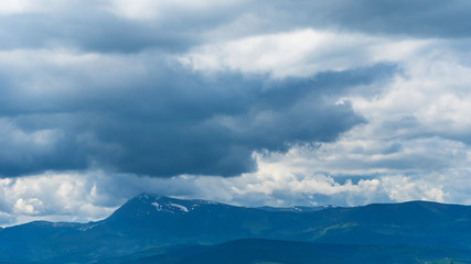 Magnificent panoramic view the mighty Carpathians Mountains and dramatic sky background. Beauty of wild virgin Ukrainian nature. Peacefulness