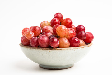 Red Grapes In Small Round Ceramic Bowl