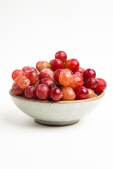 Red Grapes In Small Round Ceramic Bowl