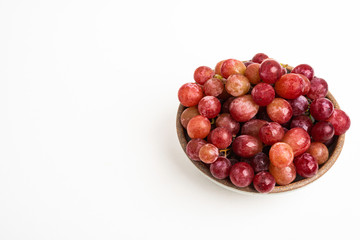 Red Grapes In Small Round Ceramic Bowl