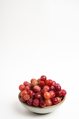 Red Grapes In Small Round Ceramic Bowl