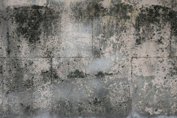 Granite stone wall surface with moisture texture - dirty pattern with squares for background	