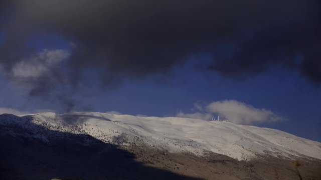 Timlaps Mount Hermon. shadow of clouds on the snowy mountain  4K video