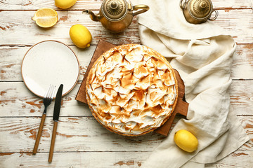Tasty lemon pie on wooden table