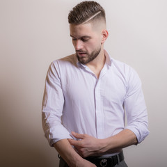 Handsome young elegant man studio portrait.