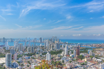Fototapeta na wymiar Scenic view of Cartagena cityscape, modern skyline, hotels and ocean bays Bocagrande and Bocachica from the lookout hill of Santa Cruz convent (Convento de la Popa)
