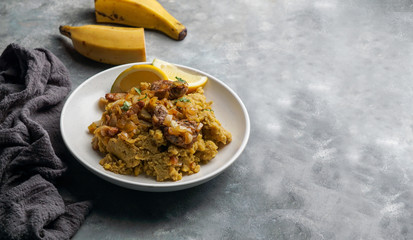 Fufu de platano verde maduro, tacaho, Mofongo, mashed  boiled plantains with porc meat, onion. Puerto Rico.  Amazonian cuisine, Peru, Cuba