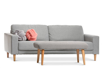 Modern sofa and bench on white background