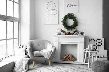 Stylish interior of living room with Christmas decor