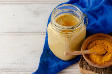 Healthy smoothie with turmeric and orangeg banana and cinnamon