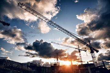construction site with cranes and buildings