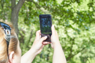girl pictures of nature on the phone