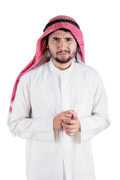 Worried Arabian man looking at the camera