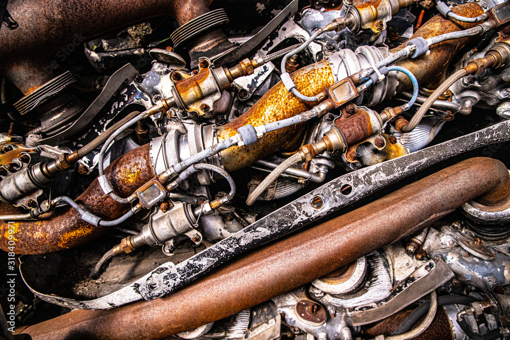 Wall mural Detailed close-up of rusty parts in old airplane engine