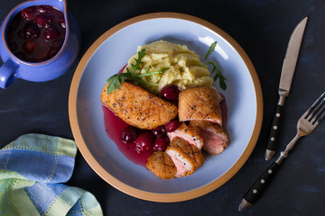 Duck breast with cherry wine sauce and mashed potato. View from above, top view