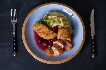 Duck breast with cherry wine sauce and mashed potato. View from above, top view
