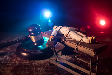 Prisoner handcuffed to death by lethal injection, vial with sodium thiopental and syringe on top of...