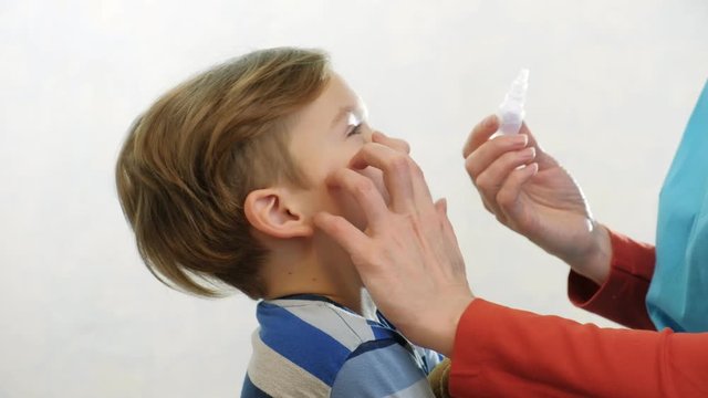 Medical health care doctor child eye drip, face.