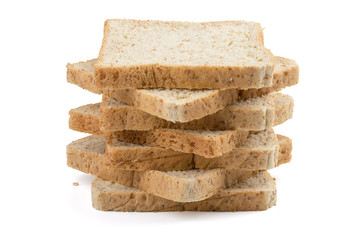 Stack of healthy whole wheat bread slices isolated on white background. Image stacking technique.