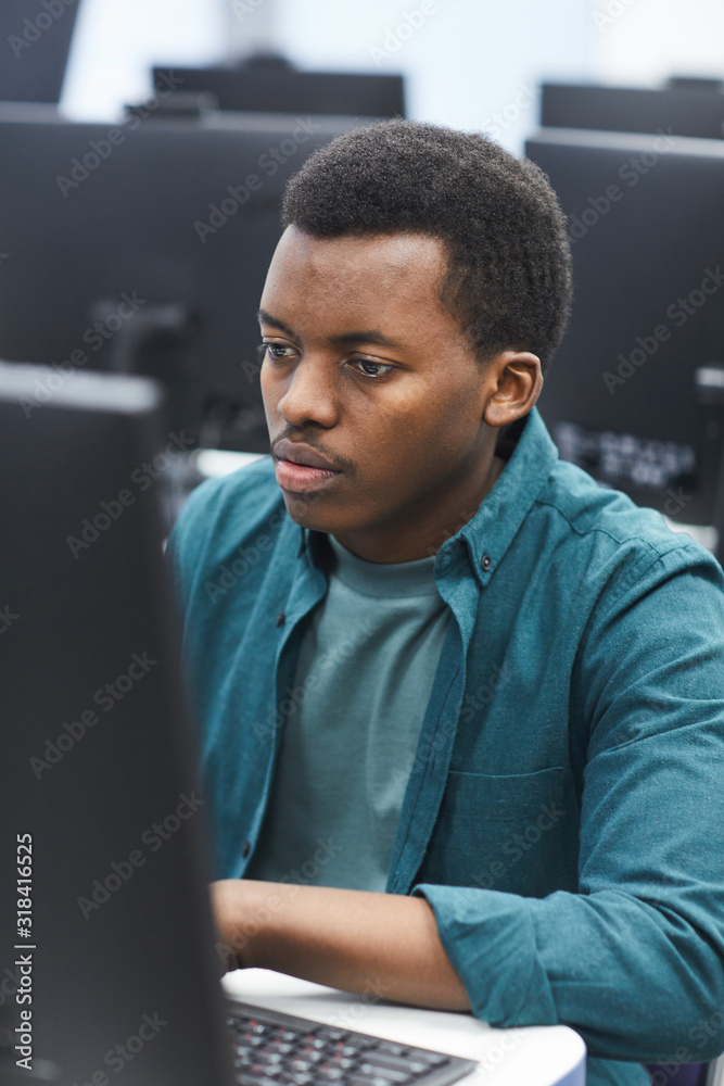 Canvas Prints high angle portrait of african-american man using computer in class of college library, copy space