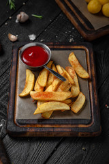 The Best Snacks for beer. Cheese sticks, chicken snacks, fried potatoes and balls, black bread with garlic and squid. Octoberfest party dinner. Festive table with delicious mediterranean food.